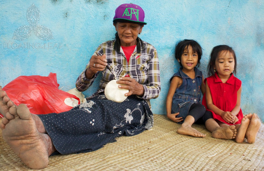 Grandma and granddaughter spend quality time together creating artwork under the water catchment building