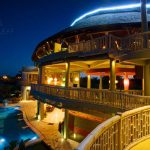 the view of Bali Floating Leaf at night with the pool and the common area